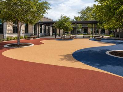 School courtyard in red and tan rubber surfacing